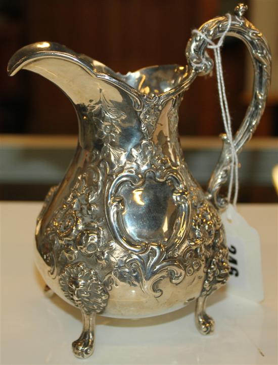 Robert Hennell silver repousse-decorated cream jug, vacant cartouche, London 1862